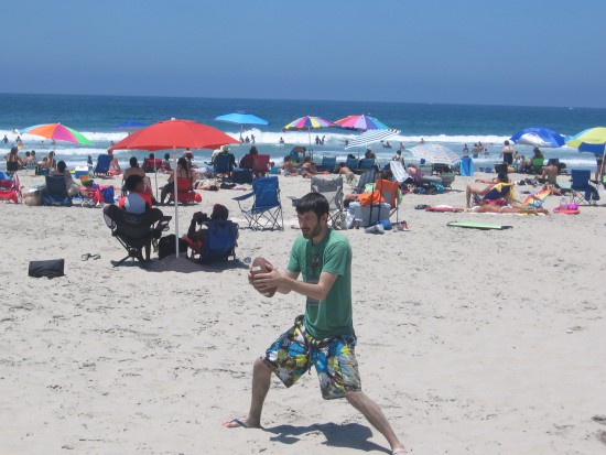 Playing football on the nearby sand at Mission Beach.