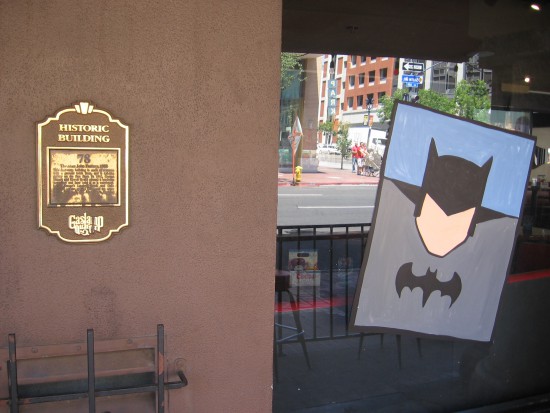 The Dark Knight watches from a historic Gaslamp building.