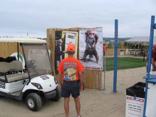 Guy checks out some silly, raunchy posters.