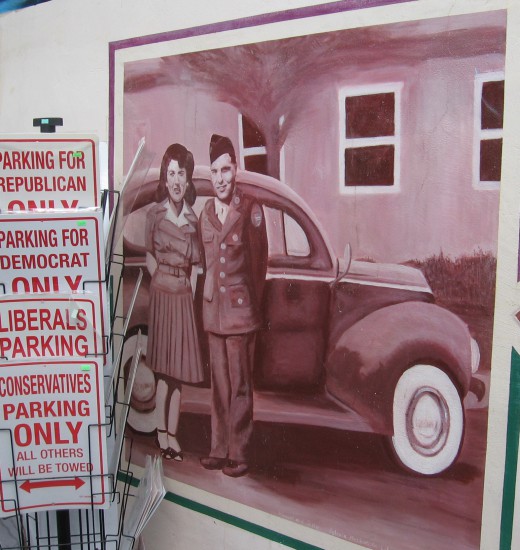 Sepia tone World War II era figures stand by old car.