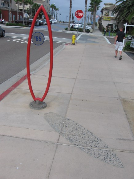 Surfboard sculpture in outdoor museum.