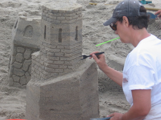 Plastic fork with two tines removed is used to create stonework detail.