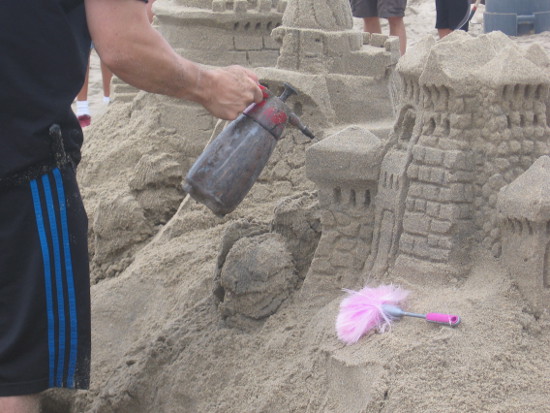 Sand creations are sprinkled with water to prevent disintegration.