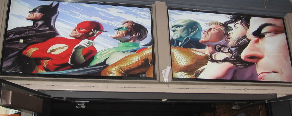 Alex Ross cool Justice League graphic above a Gaslamp door.