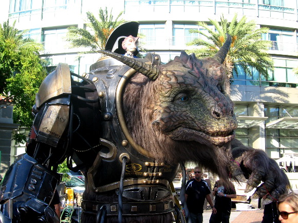 This fantastic beast is called the Giant Creature. It's piloted by a small alien on top. The creature was moving about for the nearby crowd.