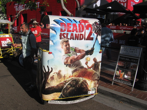 Dead Island 2 ad on back of enterprising pedicab.