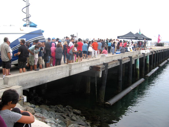 Television reporters and San Diegans await opening of dockside market!