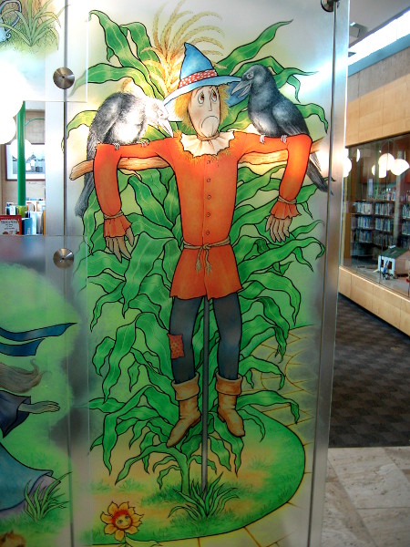 The Scarecrow greets library visitors.