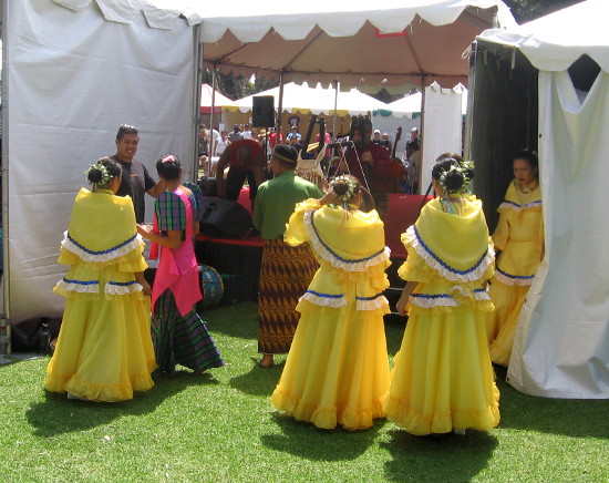Folk dancers prepare to go on stage at today's cultural exhibition.