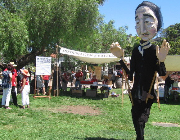 And here comes a towering puppet of American author Edgar Allan Poe!