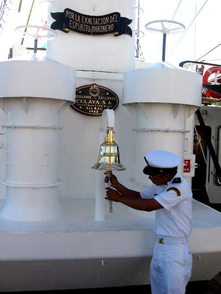 Mexican Navy officer checks the ship's bell.