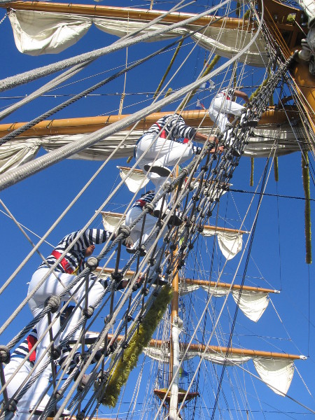 A line of Mexican sailors ascends toward the sky.