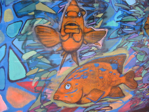 A colorful underwater scene can be glimpsed by passing motorists.