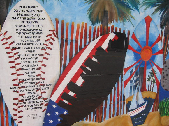 Various surfboards -- one contains an ode to baseball's World Series.