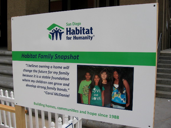 Sign explains how home ownership is beneficial for families.