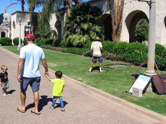Kids, hula hoops and sunshine on El Prado in San Diego's Balboa Park.