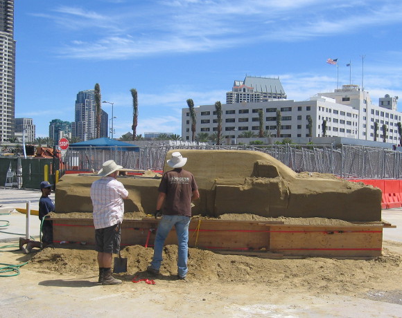 These guys are working on a life-sized sand truck!