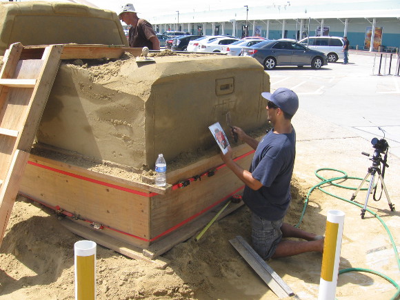 Carefully adding Chevrolet logo to back of the detailed sculpture.