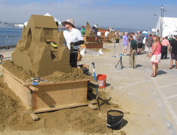 Teams create fantastic sand sculptures out toward the end of the pier.