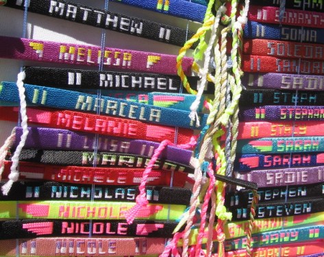 A rainbow of colors! Name bracelets alphabetically ordered.