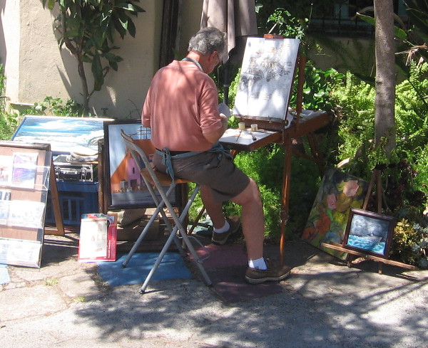 Artist at work outside one studio in Balboa Park's Spanish Village.