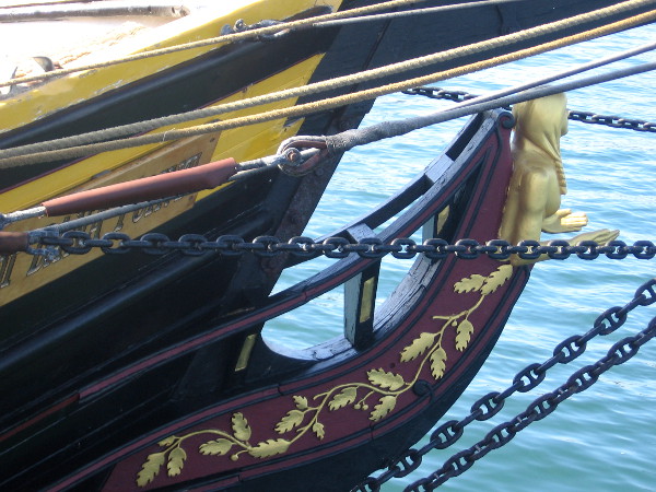 Golden female figurehead gazes out across San Diego Bay.