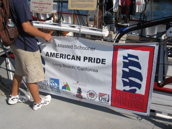 Three-masted schooner American Pride awaits across the dock.