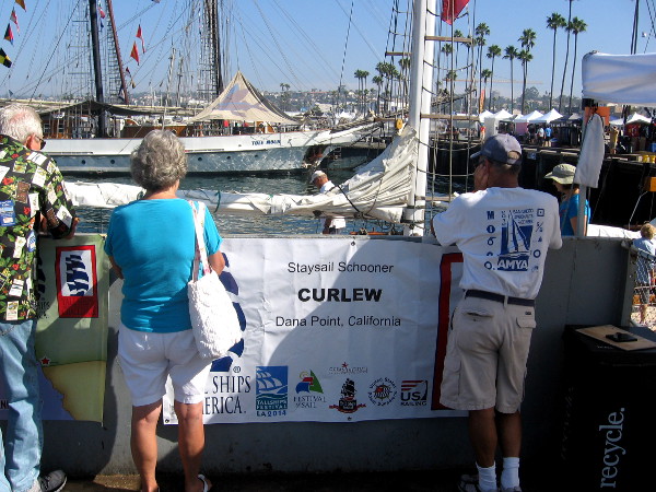 People prepare to board the small staysail schooner Curlew