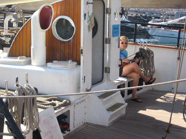 A couple young ladies on board were playing musical instruments for visitors.