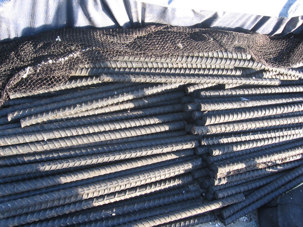 Steel rebar and nets form interesting patterns of light and shadow.