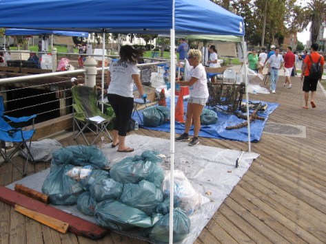 Bags of trash are collected as the morning progresses.