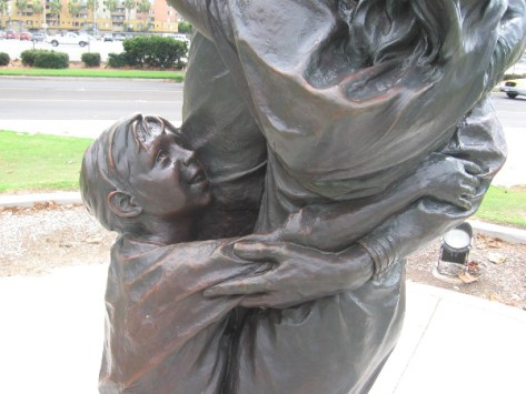 Child is happy that Dad is home from deployment.