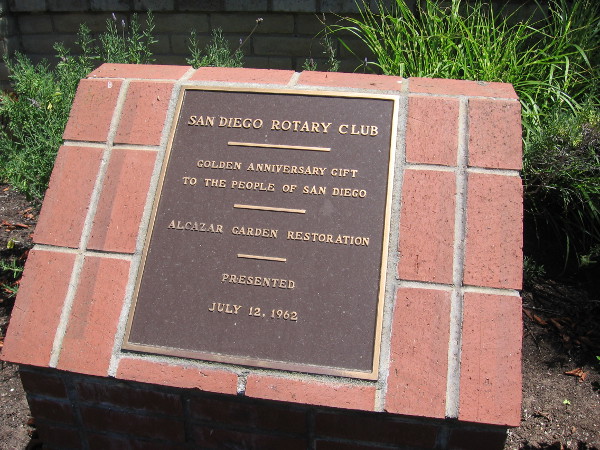 Rotary Club plaque reveals that the garden underwent a restoration.