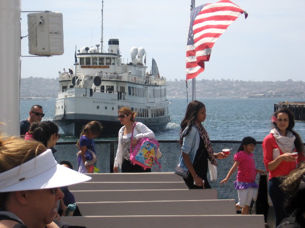 The Lord Hornblower approaches as people disembark from Coronado ferry.