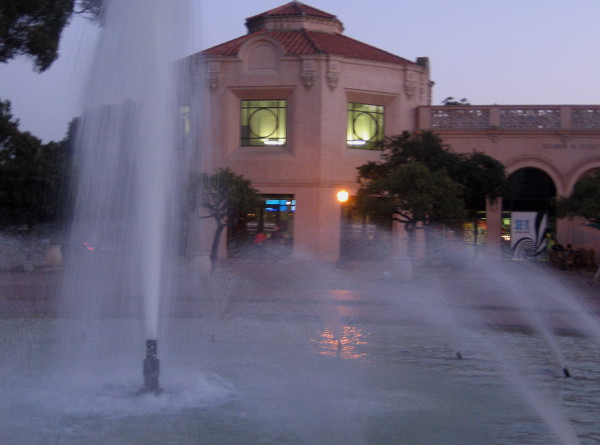 The nearby fountain takes on a beautiful glow as night descends.