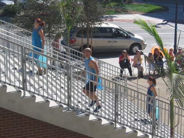 The dancers retreat to prepare for the next group in a few minutes.