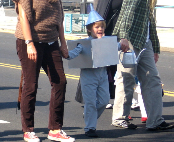 Boy dressed as tin man enjoys Boulevard BOO! Parade in San Diego.