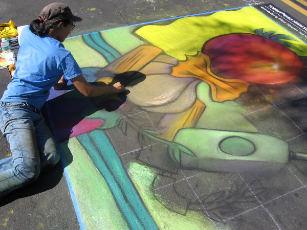 Torrey Pines High School National Art Honor Society student works on asphalt canvas.