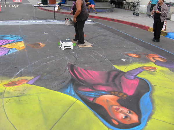 Cecelia is well underway creating the amazing 20 by 30 foot chalk image.