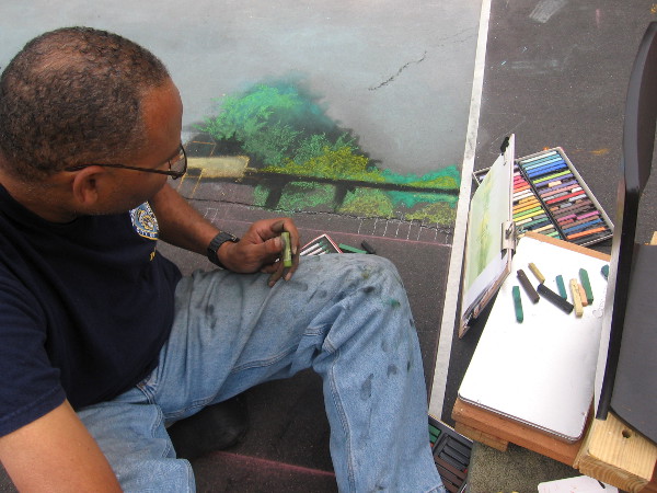 Art Within Reach is creating a landscape of trees using chalk.