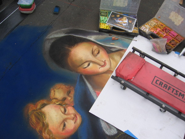 Tonie Garza chalk art of several tender, beautiful faces.