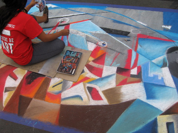 Team Noni produces unusual abstract chalk art showing biplanes over a cityscape.