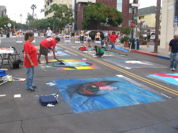 After bending over a lot, I stretch and look down Date Street at the talented artists.