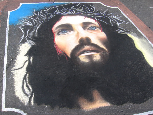 Team Pinoy chalk art shows face of Jesus on a bible.