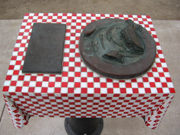 Metal sculpture of blackened fish taco plate in Little Italy's unique Amici Park.