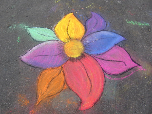 Just a flower someone drew on the asphalt for no reason other than pure joy.