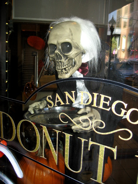 Donut Bar window contains a scary skull-headed server!