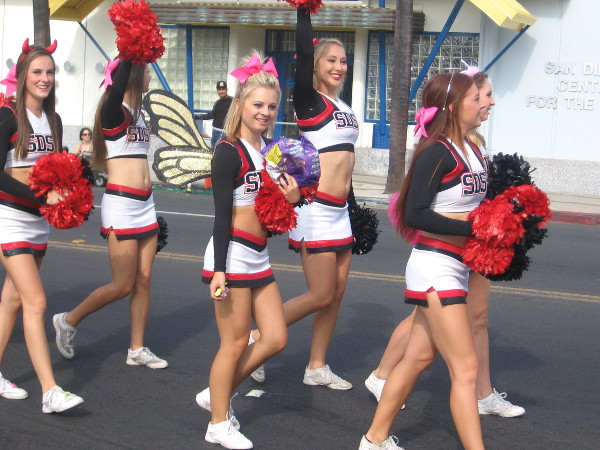 Here come some smiling SDSU cheerleaders.
