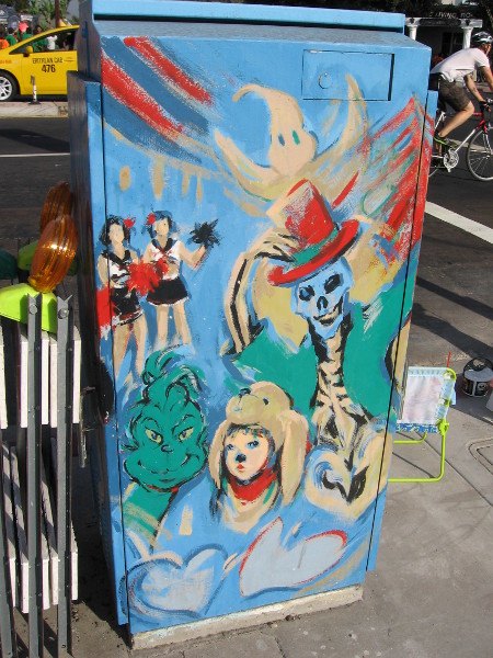 Utility box on El Cajon Boulevard painted with scenes from BOO! Parade.
