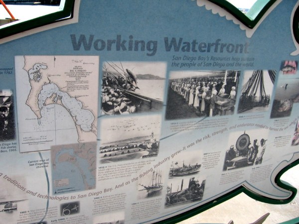 Working Waterfront sign shows photographs from San Diego's rich fishing history.